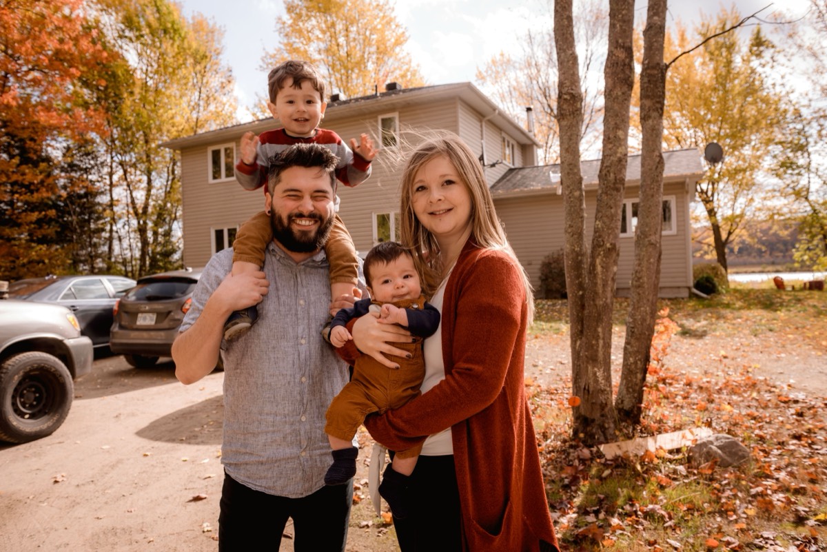 Family smiling together outdoors